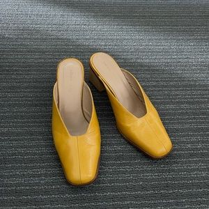 LOQ Galapagos mule in a gorgeous mustard yellow patent leather.
